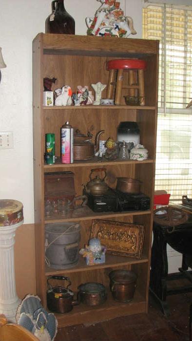 This shelf has some of the glass and china and other items that we have.