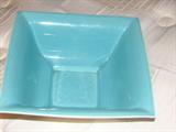 This beautiful aqua-colored dish has interesting Art-Deco lines, and it is marked on the bottom: GMcB