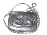 Dad didn't notice this before I got there to take photos, but this is a genuine black Chanel clutch with shoulder strap.  Be there early on Wednesday to snap this one up!