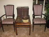 This grouping features the dark-stained wood arm chairs with an Asian style as well as an end table and a really neat antique spool-type cabinet that could be employed for multiple purposes.