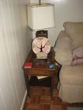 An end table, lamp, and some of the collectibles available at the Acree sale.