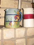 This photo shows two of the remaining collectible pottery pitchers available at this sale.