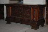 Massive carved chest of Mexican cedar.  It has iron hardware and full releaf caryatids carved on each end.  It is 55x23x30 and is believed to be from Mexico and c. 1934.
