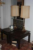 Here are two Oriental styled end tables.  Each is approximately 30x20x20.  You can also see a pair of brass or brass finish table lamps.  These lamps are high quality as is almost everything at this sale.