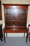 China cabinet in cherry measures about 44x20 at the waist and stands about 69" tall.  American c.1840.