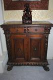 This small RENAISSANCE credenza is in walnut.  It has a single freize drawer and a cupboard below enclosed by a pair of panel doors.  There are two CARYATIDS  carved on each side.  It is 29x14x32, is from italy and dates to the early seventeenth century.