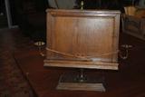 This oak book or bible stand is two sided.  It is 19"tall and 16" wide plus the two bronze candle sticks on the sides.