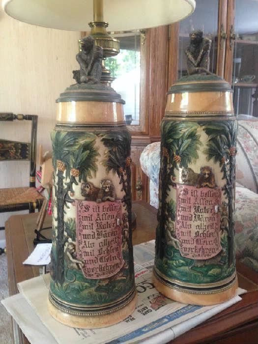 Rare Monkey large German Steins, hall marked, circa. 1895-1905.  Approximate sizes are 18 & 20 inches tall. Not repros or tourist pieces, the real deal.