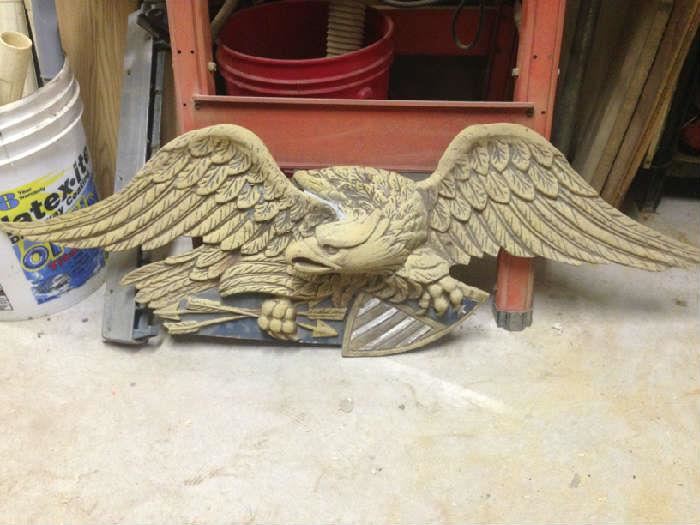 Early antique 20th century cast eagle with shield, approximately 36 inches in length.