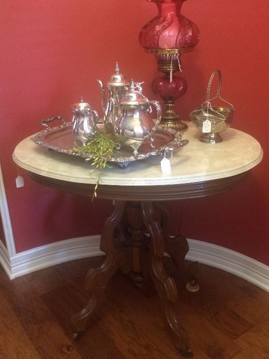 Antique oval marble top table; tea service; Fenton "Gone With the Wind" lamp