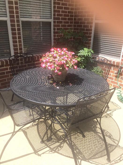 Another patio table with 4 chairs