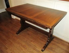 pub table with leaves under table top