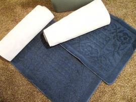 a pair of long roll out hall rugs