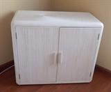 Cream color 2 door cabinet coordinates with living room furniture