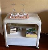 Sculpted rattan cream color rolling cart