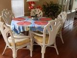 Dinette set in cream color sculpted rattan with 5 arm chairs and glass top table
