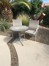 Small wooden round table with 2 straight back chairs