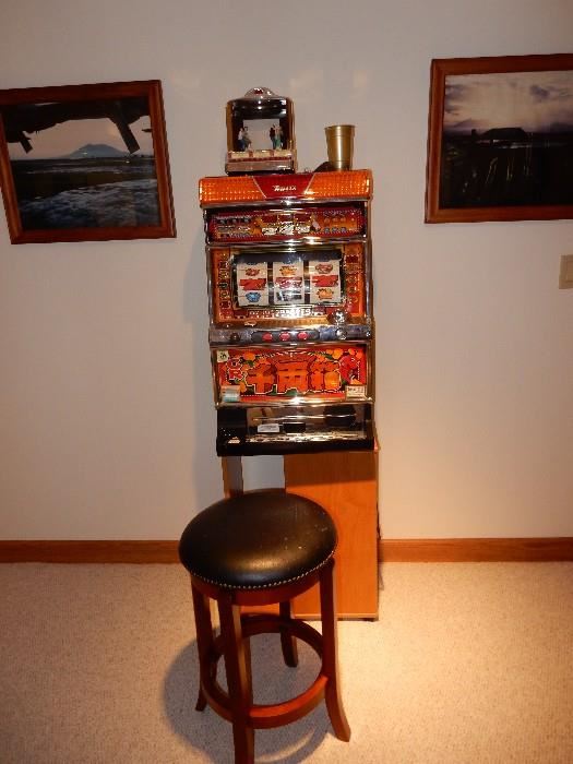 The slot machine lights up and all working  includes stand and stool. I have not won a red cent though.