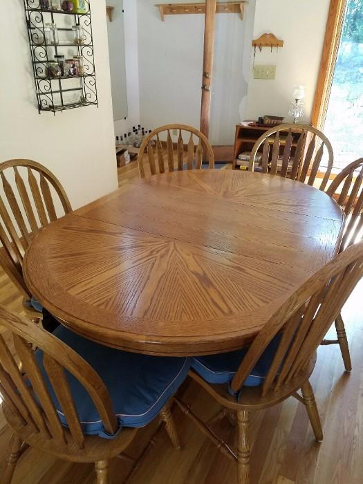 Nice Round Table with Leaf which makes it into an Oval. 6 Chairs. 