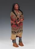 Skookum Indian Doll
The painted composition head with black hair, wearing wool clothes, remnants of an old label on the underside of one moccasin. 18 1/2" high    Bid at www.fairfieldauction.com through Wed. July 20th