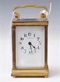 Tiffany Carriage Clock
White dial marked "Tiffany & Co / France"; with double-sided winding key. 4 1/2" high to top of case, 3" wide, 2 1/2" deep  Bid at www.fairfieldauction.com through Wed. July 20th