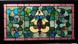 Stain Glass Window Panel
A heart flanked by foliated scrolls, with bulls-eye glass elements. 19 1/2" x 38", in a wooden frame 23 1/2" x 42 1/2".  Bid at www.fairfieldauction.com today through Wed. July 20th