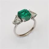 Emerald and Diamond Platinum Ring
the emerald approximately 3.85 cts measuring 10.75 mm x 9.30 mm x 5.70 mm set with two side triangle diamonds approximately 1.36 cts tw, VVS1 - VS 1 color G/H/I ring size 6.  Bid at www.fairfieldauction.com today through Wed. July 20th