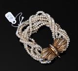 Seed Pearl and Diamond 14k Gold Bracelet
with eight strands of pearls and a 1 3/4" long 14k gold diamond clasp 7" long overall.  Bid at www.fairfieldauction.com today through Wed. July 20th
