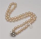 Strand of Pearls with Elaborate Diamond Clasp
24" long, pearls measure 10 mm.  Bid at www.fairfieldauction.com today through Wed. July 20th