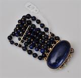 18k Gold and Lapis Bracelet
consisting of 5 strands of lapis and gold beads 6" long 37.4 dwt gross.  Bid at www.fairfieldauction.com today through Wed. July 20th