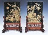 Pair of Chinese Jasperware Table Screens
each double-sided, with figures in a landscape on one side, birds and flowers on the reverse; with pierced and carved hardwood stands. 17 1/4" high overall x 11" wide overall x 6" deep overall Late 19th century.  Bid at www.fairfieldauction.com today through Wed. July 20th