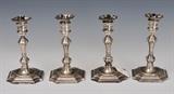 Set of Four Cartier Sterling Silver Candlesticks
pattern # 2553, with cement-filled feet. each 8" high 49.5 troy ounces gross.  Bid at www.fairfieldauction.com today through Wed. July 20th