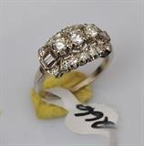 Diamond 14k Gold Ring
the three central diamonds surrounded by smaller diamonds, the largest stone  approximately .20 ct.  Bid at www.fairfieldauction.com today through Wed. July 20th