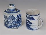 Chinese Export Blue and White Mug and Tea Caddy
Comprising a hexagonal Canton covered tea caddy and a Nanking mug, both probably mid 19th century neither marked Tea caddy: 6 3/4" high, 5" wide, 3 1/8" wide Mug: 4 3/4" high, 5 1/2" across handle, 3 5/8 diameter.  Bid at www.fairfieldauction.com today through Wed. July 20th