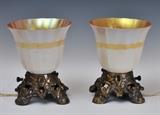 Pair of Small Bronze Lamps with Steuben Shades
Neither marked 6 3/4" high overal x 6" wide x 6" deep.  Bid at www.fairfieldauction.com today through Wed. July 20th