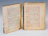 Hand Written Qur'an
dated 1716 Bound in red Moroccan leather, with hand-coloring throughout. 8 1/2" x 6 3/4" x 2"  signed Ali, the son of Sheikh Ahmed, the son of "The Sparrow".  Bid at www.fairfieldauction.com today through Wed. July 20th