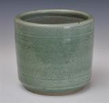 Chinese Celadon Cylindrical Jardiniere
With stylized underglaze decoration, unmarked. 7 1/2" high x 8" diameter.  Bid at www.fairfieldauction.com today through Wed. July 20th