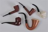 Group of Five Pipes
Comprising three Charatan, a calabash pipe and a carved Meerschaum pipe. Together with a modern display case. 5" to 7 1/4" long.  Bid at www.fairfieldauction.com today through Wed. July 20th