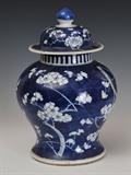 Chinese Blue and White Cherry Blossom Temple Jar
Domed cover with round finial; underside of foot with four marks.  13 1/4" high, approximately 8 1/2" diameter.  Bid at www.fairfieldauction.com today through Wed. July 20th