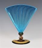 Steuben Blue Fan Vase
Unsigned, with amber foot. 11" high, 9 1/4" wide, 5 1/4" diameter of foot.  Bid at www.fairfieldauction.com today through Wed. July 20th