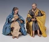 Pair of Italian Creche Figures
Depicting Mary and Joseph With molded and polychromed plaster heads and limbs, straw bodies garbed in silk robes, seated on wooden chairs, undersides of feet marked ITALY; under glass domes on turned wooden bases. Figures approximately 8" high.  Bid at www.fairfieldauction.com today through Wed. July 20th