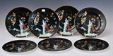 Eight Royal Worcester Famille Noire Plates
With gilt rims, hand-painted highlights, overglaze mark underneath. 9" diameter.  Bid at www.fairfieldauction.com today through Wed. July 20th