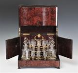 Napoleon III Burl Amboyna Tantalus
Enclosing 4 decanters and 16 cordials, the case sides hinged. With one key. Tantalus 10 3/4" high, 13" wide, 10" deep.  Bid at www.fairfieldauction.com today through Wed. July 20th