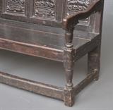Jacobean Oak Settle
Crest dated 1688, bearing initials RMS, the back with five panels carved with crests inscribed AMOR PATRIAE. 40 1/4" high, 66" long, 24" deep.  Bid at www.fairfieldauction.com today through Wed. July 20th