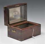 Benson & Hedges Rosewood Humidor
with brass mounts Inside of lid bearing label,  lid plaque engraved FC 1912, with key. 7 1/2" high, 13 1/2" wide, 9 1/4" wide.  Bid at www.fairfieldauction.com today through Wed. July 20th