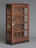 Gustav Stickley Oak China Cabinet
Craftsman Stickley paper label verso 58" high, 35 1/2" wide, 13" deep.  Bid at www.fairfieldauction.com today through Wed. July 20th