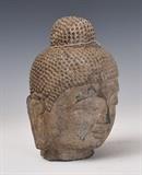 Japanese Shinto Carved Stone Head
Uneven base edge 10" high.  Bid at www.fairfieldauction.com today through Wed. July 20th