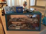 This show case has, vintage lapel pins, a collection of baseball costume jewelry, including Texas Rangers items. Model airplanes, vintage Cowboys bobble head.