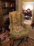 There are two wing back chairs both in same fabric