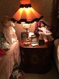 Porcelain Cabbage Patch Doll, vintage lamp, and side table matched the dressing table.